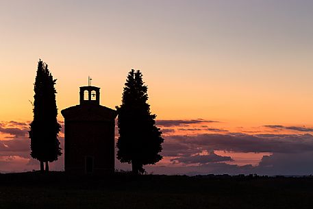 Silhouette on sunset of the chapel of Madonna di Vitaleta