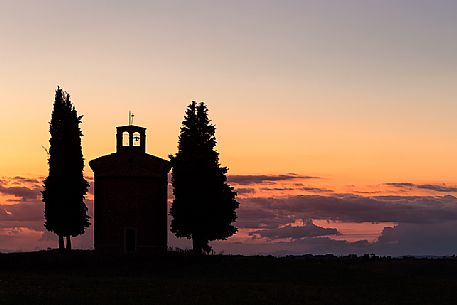 Silhouette on sunset of the chapel of Madonna di Vitaleta