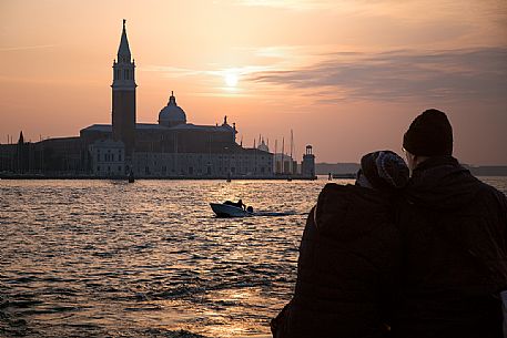 Romantic scene on sunset in front of the Basilica of St Giorgio Maggiore 