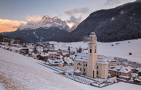 The village of Sesto in Pustertal with the Parish Church and the Sesto's sundial on background