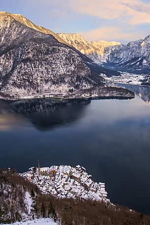 View from above of  Hallstatt's lake with the small village of Hallstatt in featured