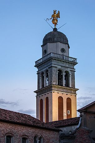 The golden angel of the bell tower of the church of Santa Maria di Castello The golden angel of the bell tower of the church of Santa Maria di Castello