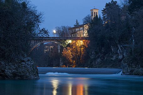 Evening's light reflected in the Natisone river under the Devil's bridge in Cividale del Friuli