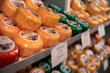 Typical Dutch cheeses in one of the shops of the famous chain Henri Willig Typical Dutch cheeses in one of the shops of the famous chain Henri Willig