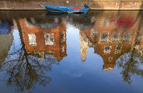 Reflections on the Spaarne canal in Haarlem, the capital of the province of North Holland