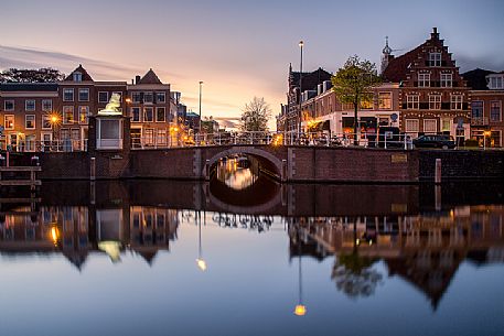 The port area of Haarlem , the capital of the province of North Holland , with houses reflected in the Spaarne canal
