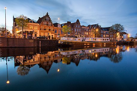 The port area of Haarlem , the capital of the Province of North Holland , with houses reflected in the Spaarne canal