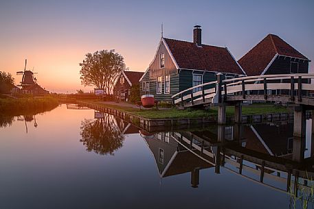 Zaanse Schans , the small community of 40 homes located north - east of Amsterdam , on the quay of the river Zaan; it's one of the highlights of the Netherlands