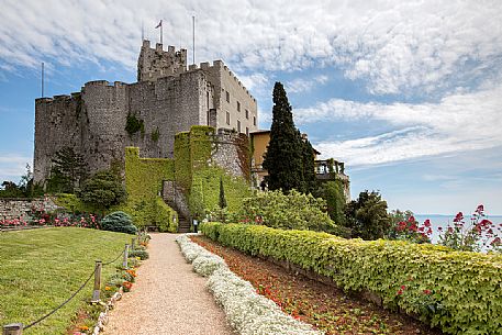 The park of Duino Castle with its walls to shield and behind sixteenth-century tower