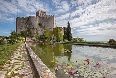 The park of Duino Castle with its walls to shield and behind sixteenth-century tower