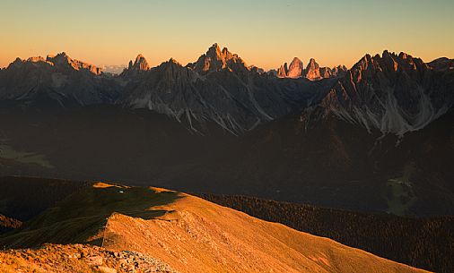 Sunset at the Sesto Dolomites from Corno Fana in Dobbiaco, in the background
the Tre Cime di Lavaredo, South Tyrol, Italy