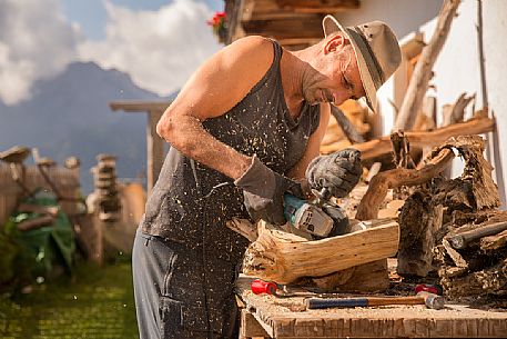 Wood worker at the alpine lodging Niggler (Nigglerhof) in San Silvestro valley - Dobbiaco Wood worker at the alpine lodging Niggler (Nigglerhof) in San Silvestro valley - Dobbiaco