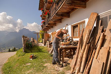 Wood worker at the alpine lodging Niggler (Nigglerhof) in San Silvestro valley - Dobbiaco Wood worker at the alpine lodging Niggler (Nigglerhof) in San Silvestro valley - Dobbiaco
