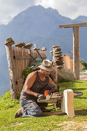 Wood worker at the alpine lodging Niggler (Nigglerhof) in San Silvestro valley - Dobbiaco Wood worker at the alpine lodging Niggler (Nigglerhof) in San Silvestro valley - Dobbiaco
