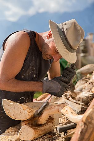 Wood worker at the alpine lodging Niggler (Nigglerhof) in San Silvestro valley - Dobbiaco Wood worker at the alpine lodging Niggler (Nigglerhof) in San Silvestro valley - Dobbiaco