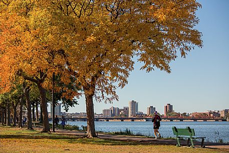 Jogging along the Boston Charles river in autumn, Boston, New England, USA
