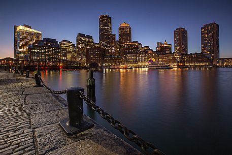 Boston skyline from the Boston harbor during the blue hour, New England, USA Boston skyline from the Boston harbor during the blue hour, New England, USA