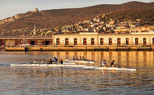 Boating along the waterfront of Trieste at sunset, Italy