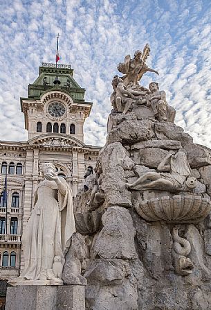 The fountain of the Four Continents and the Town Hall on background, Trieste, Italy