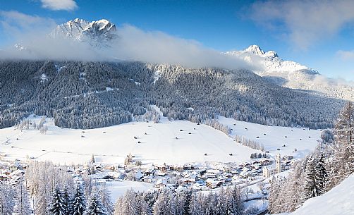 Sesto village and the Sesto dolomites in the background after a snowfall, Pusteria valley, Italy Sesto village and the Sesto dolomites in the background after a snowfall, Pusteria valley, Italy