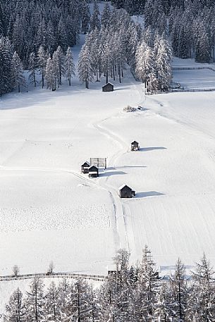 The barns of Sesto dresses in winter, Dolomites of Sesto natural park, Pusteria valley,Italy The barns of Sesto dresses in winter, Dolomites of Sesto natural park, Pusteria valley,Italy