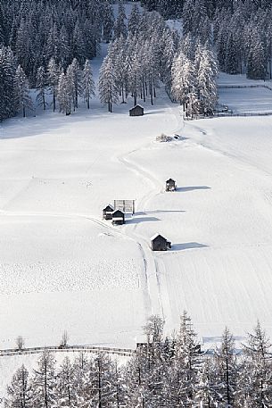 The barns of Sesto dresses in winter, Dolomites of Sesto natural park, Pusteria valley,Italy