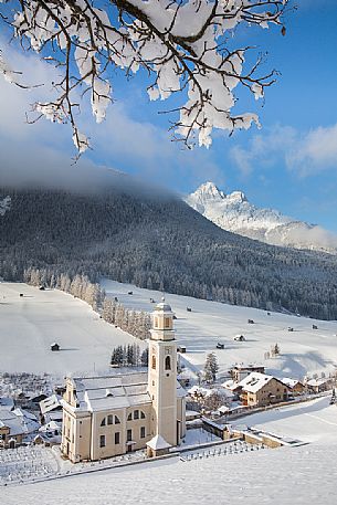 The parish church of Sesto after an intensive snowfall, Pusteria valley, Italy The parish church of Sesto after an intensive snowfall, Pusteria valley, Italy