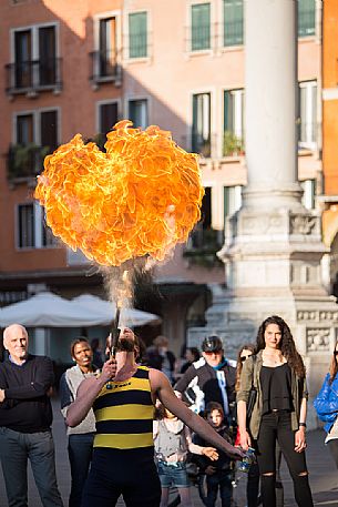 Entertainment eating-fire in Piazza dei Signori, the main square of the historic center of Vicenza, Italy