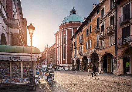 Contr Garibaldi, one of the roads that connect the city center and in the background the apse and dome of the Cathedral of Vicenza, Italy