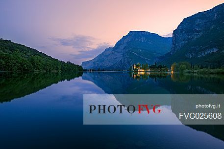The Toblino Castle reflects on the waters of the homonymous lake at twilight, Valley of Lakes, Valle dei Laghi, Trentino, Italy