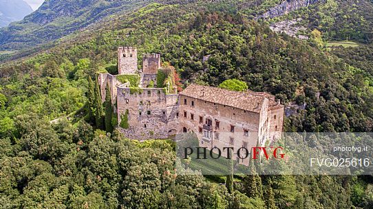 Castle Madruzzo from above, a medieval castle set on a rocky hill overlooking the homonymous village, Valley of Lakes, Valle dei Laghi, Trentino, Italy 