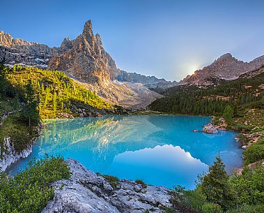 The Dito di Dio of  Sorapiss with the emerald pond of the Sorapiss illuminated by the last rays of light, Cortina D'Ampezzo, Dolomites, Italy