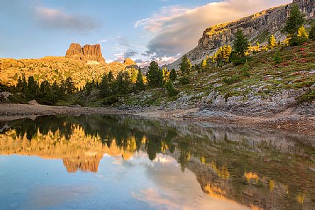 The Averau Mount reflected on the little pond of Limedes at sunset, Cortina D'Ampezzo, Dolomites, Italy