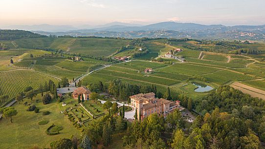 View from above of Castello di Spessa castle and the park immersed in the green of Gorizia Collio, Capriva del Friuli, Friuli Venezia Giulia, italy