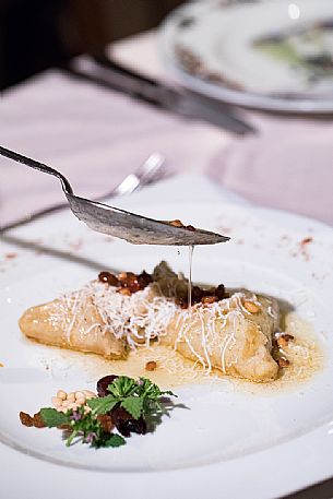 Cjarsons with smoked ricotta and spinach, a typical dish of the historic Restaurant  Al Monastero in Cividale del Friuli, Friuli Venezia Giulia, Italy