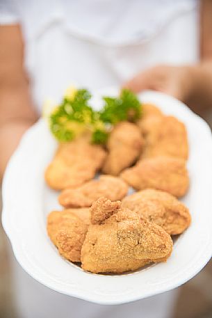 Fried chicken, a typical dish of the Osteria Sardoc in Trieste, Friuli Venezia Giulia, Italy