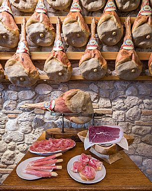 Tasting of raw ham of  La Casa del Prosciutto,the historic ham company of the  Alberti family in San Daniele del Friuli, Friuli Venezia Giulia, Italy