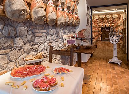 Tasting of raw ham of  La Casa del Prosciutto,the historic ham company of the  Alberti family in San Daniele del Friuli, Friuli Venezia Giulia, Italy