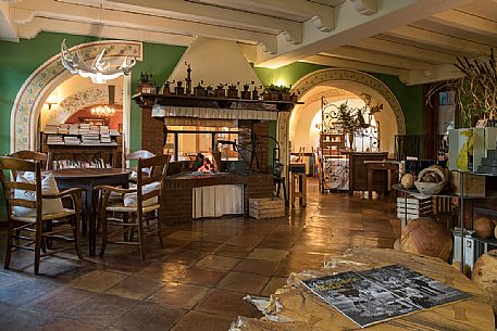 The entrance with the great fogolar of the starred restaurant La Subida, Trattoria al Cacciatore in Cormons, Friuli Venezia Giulia, Italy