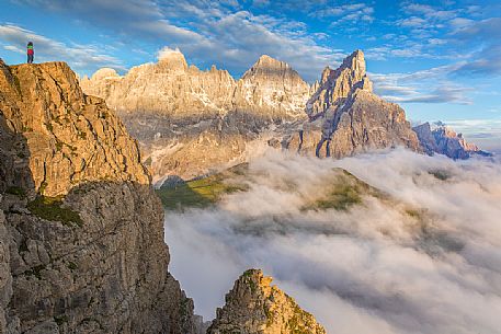The northern chain of the Pale di San Martino over a cloud of clouds photographed from the top of the path of Cristo Pensante, Trentino Alto Adige, Dolomites, Italy The northern chain of the Pale di San Martino over a cloud of clouds photographed from the top of the path of Cristo Pensante, Trentino Alto Adige, Dolomites, Italy