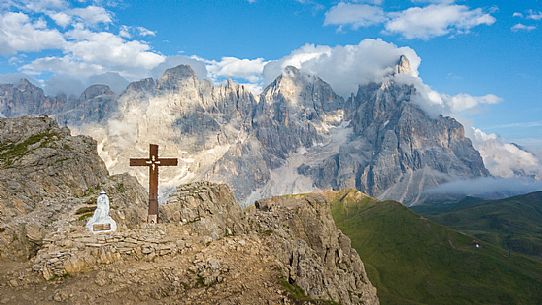 The northern chain of the Pale di San Martino and the cross with the statue of  Cristo Pensante, Dolomites, San Martino di Castrozza, Italy