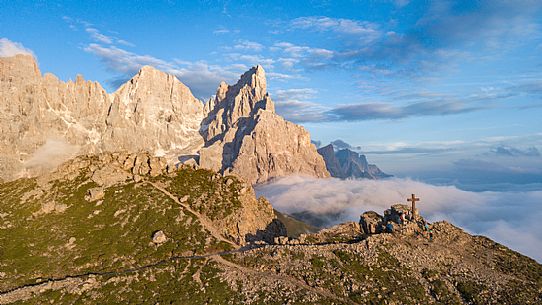 The northern chain of the Pale di San Martino and the cross with the statue of  Cristo Pensante, Dolomites, San Martino di Castrozza,  Italy