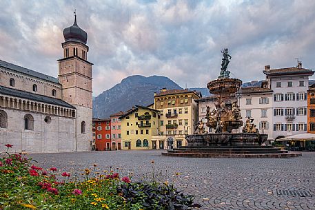 Duomo square with the Cathedral of San Vigilio and the fountain of Nettuno at sunset, Trento, Trentino Alto Adige, Italy