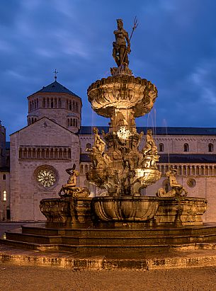 Duomo square with the Fountain of Nettuno and the Cathedral of San Vigilio in the background at twilight, Trento, Trentino Alto Adige, Italy