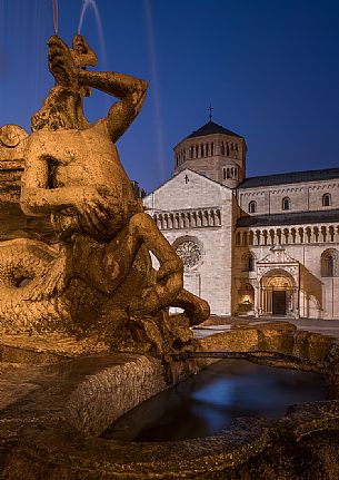 The Fountain of Nettuno and the Cathedral of San Vigilio in the background at twilight, Trento, Trentino Alto Adige, Italy