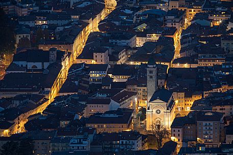Night view from above of the city of Trento with the church of San Francesco Saverio, Trento, Trentino Alto Adige, Italy