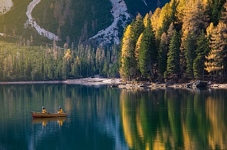 Boat trip on the Braies lake during an autumn morning, Dolomites, Pusteria Valley, Italy
