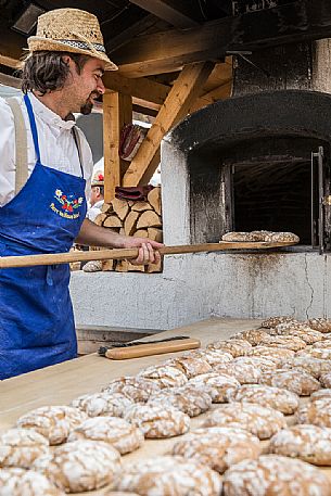 Bread preparation during the traditional bread and strudel festival in Duomo square, Bressanone, Isarco valley, Alto Adige, Italy, Europe