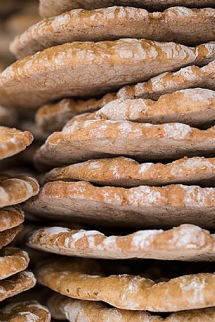 The puccia, typical tyrolean bread exposed during the traditional bread and strudel Festival in Bressanone, Alto Adige, Italy, Europe The puccia, typical tyrolean bread exposed during the traditional bread and strudel Festival in Bressanone, Alto Adige, Italy, Europe