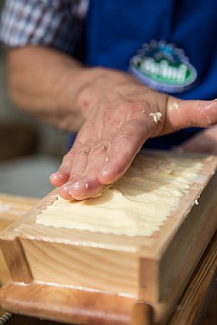 Preparation of the butter during the traditional festival of bread and strudel in Bressanone, Isarco Valley, Trentino oAlto Adige, Italy, Europe